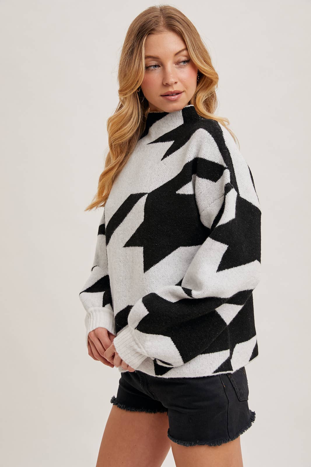 HOUNDSTOOTH MOCK NECK LOOSE FIT KNIT SWEATER IN BLACK AND WHITE available for shopping small in Northern Virginia