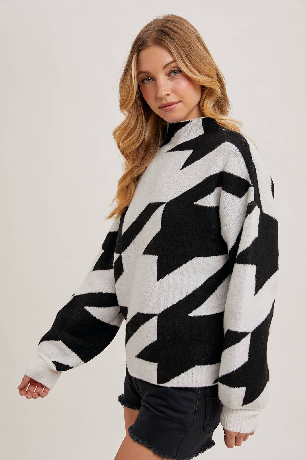 HOUNDSTOOTH MOCK NECK LOOSE FIT KNIT SWEATER IN BLACK AND WHITE available for shopping small in Northern Virginia