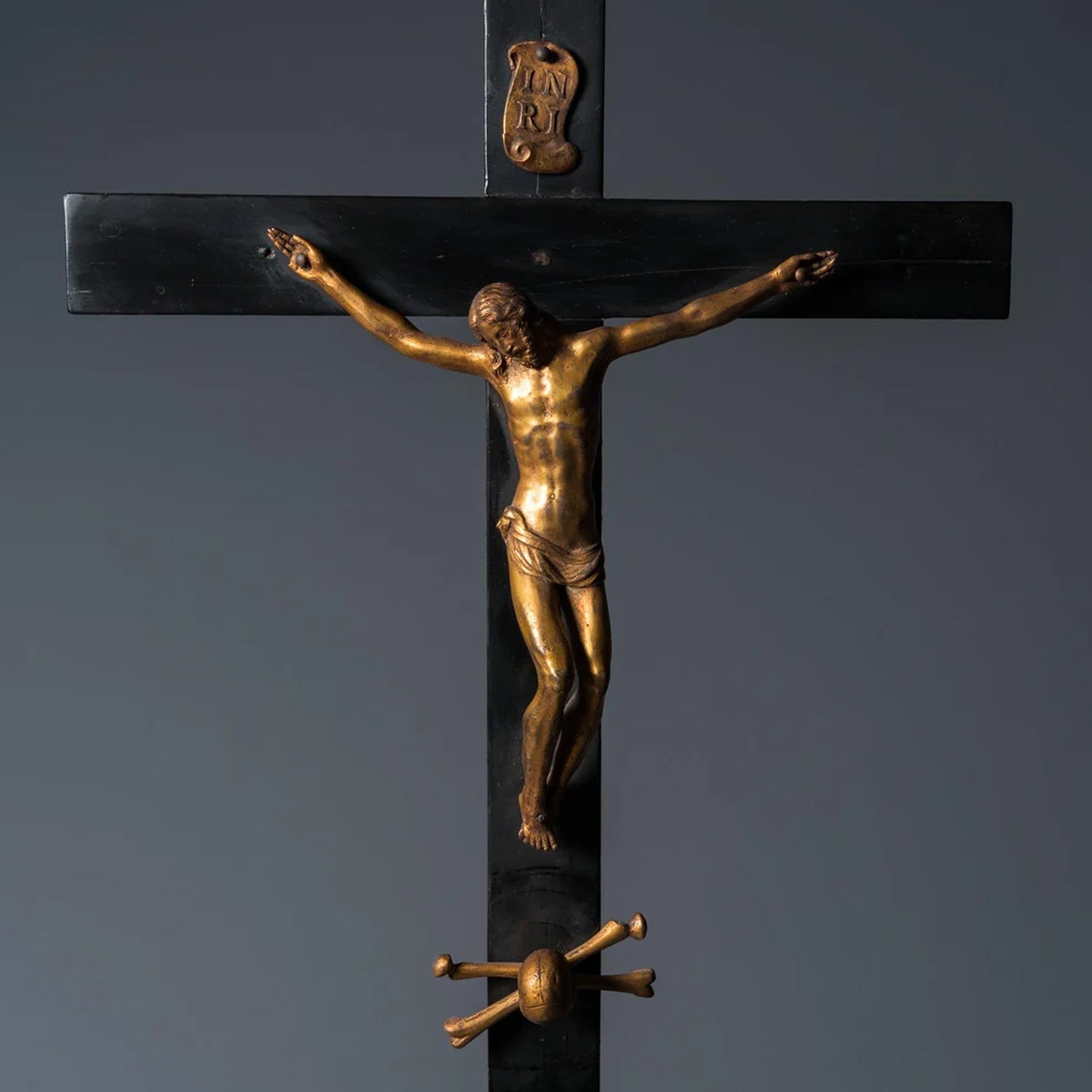 AN EBONY WOOD AND GILT BRONZE RELIQUARY ALTAR CROSS AFTER GIAMBOLOGNA