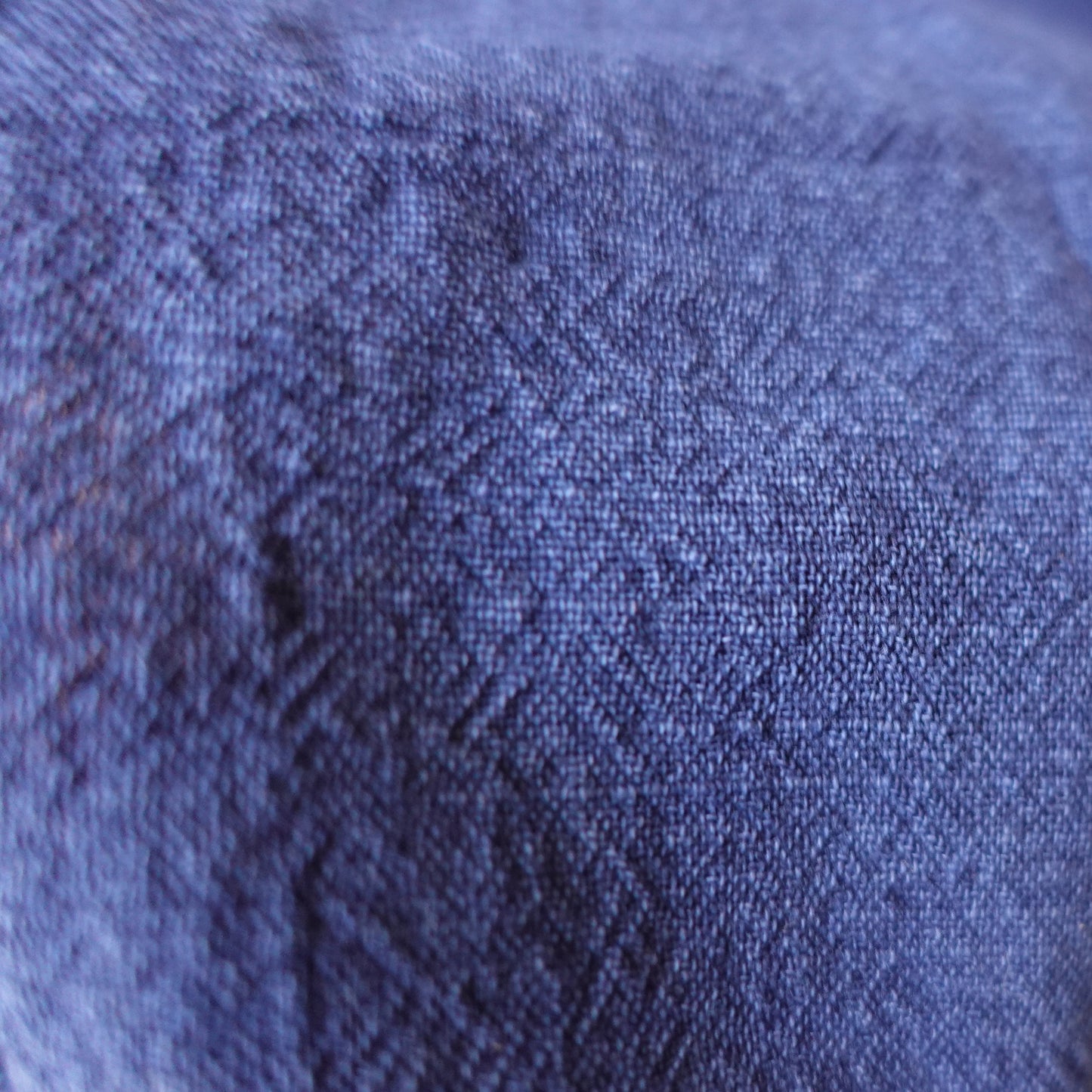 Close-up of a textured blue fabric surface