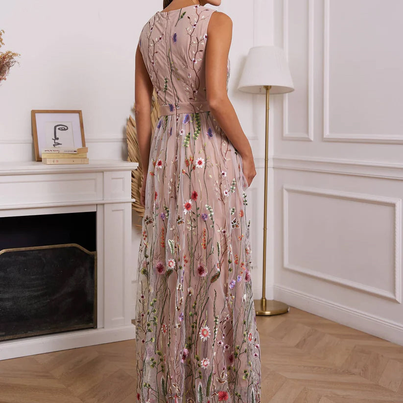 Romantic long nude dress with elegant embroidered floral motif by Choklate Paris